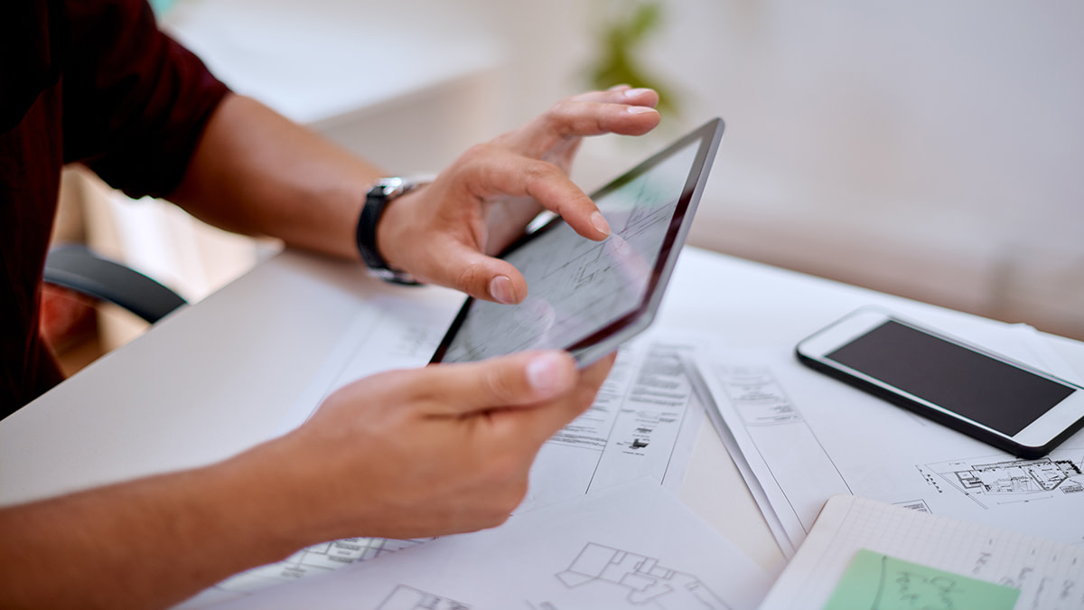 Employee using a digital tablet in an office