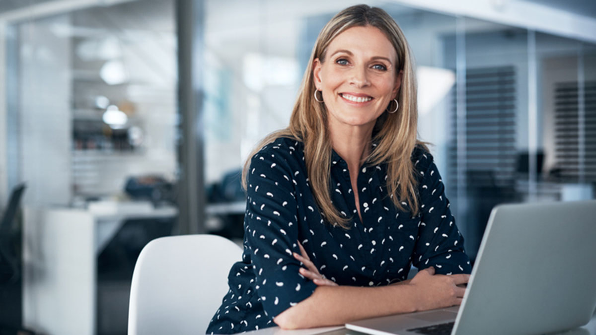 Female consultant at work smiling at the camera