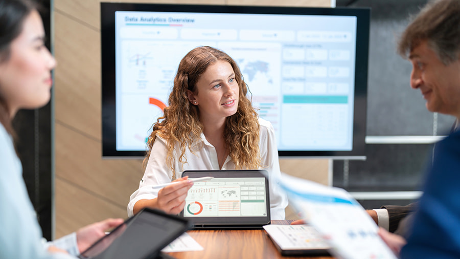 Colleagues analyzing data in a meeting